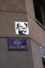 Angle de la rue Louis Blanc et de la rue Duguesclin, miroir 2011 portrait de Gandhi.
