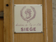 7 rue du Garet, plaque du siège de l'Académie du coq en pâte.
